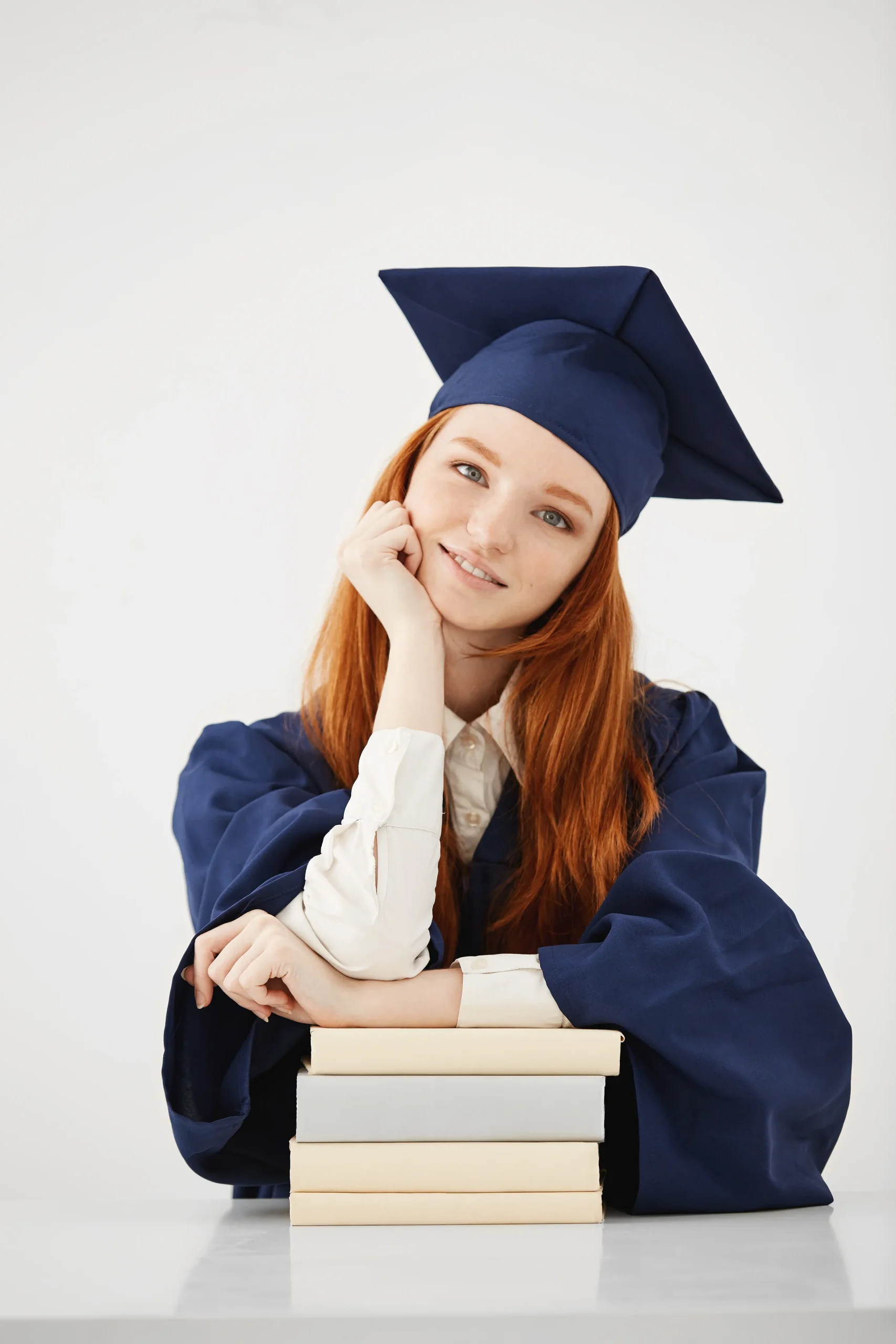 beautiful-female-graduate-with-books-smiling copy beautiful female graduate with books smiling copy